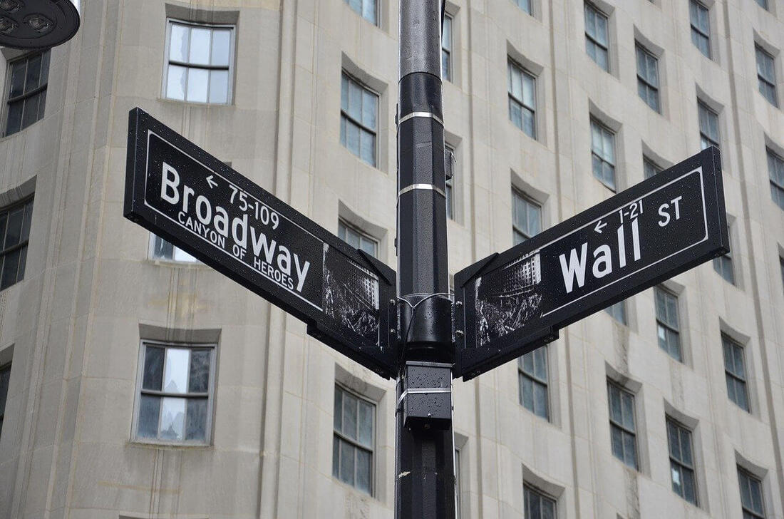 The intersection of Broadway and Wall Street, where you'd probably find some of the best investing books of all time